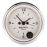 Traditional incandescent lighting illuminates around the perimeter of the dial